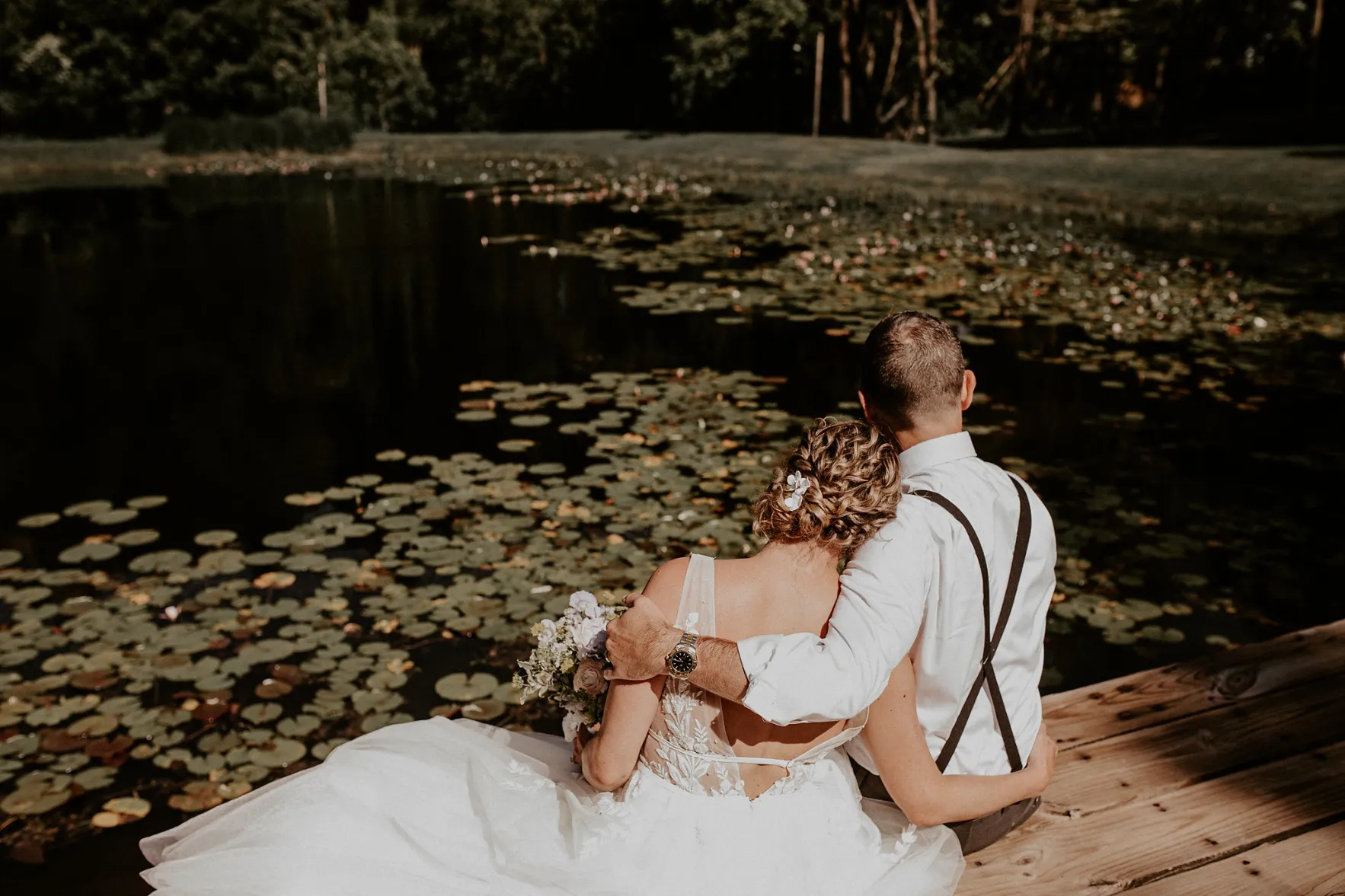 couple hugging at the pond | delaware ohio wedding venues