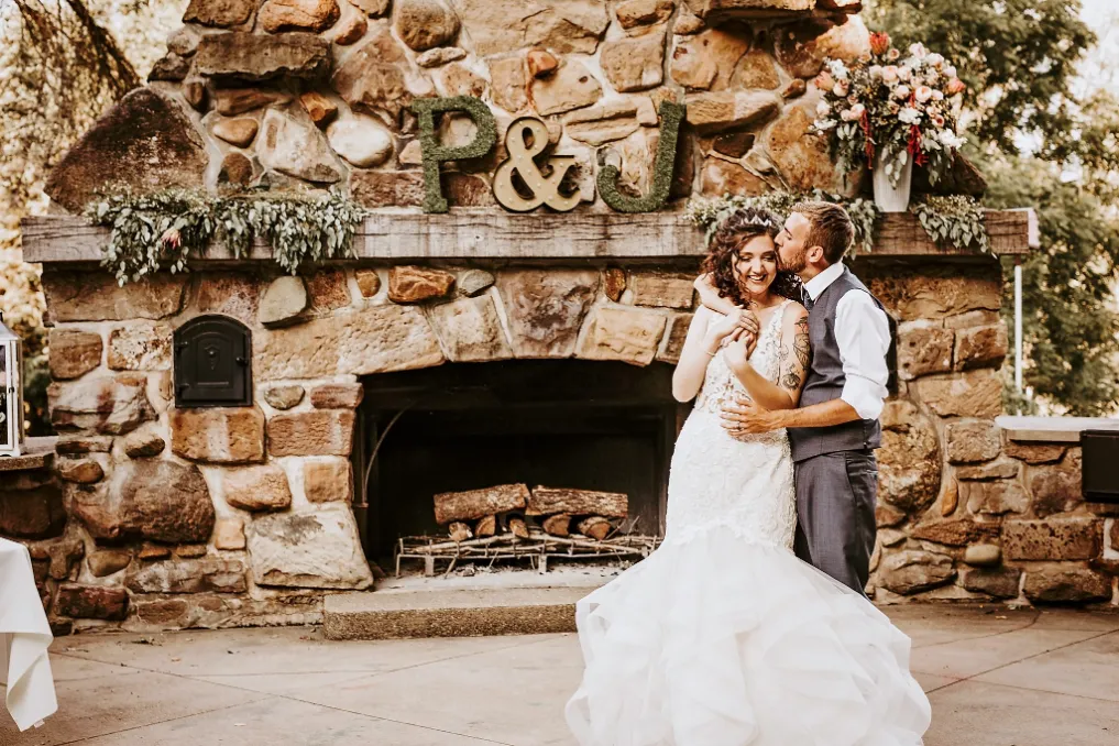 jess and perry by the fireplace